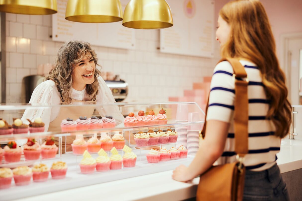 Woman working in cupcake bakery