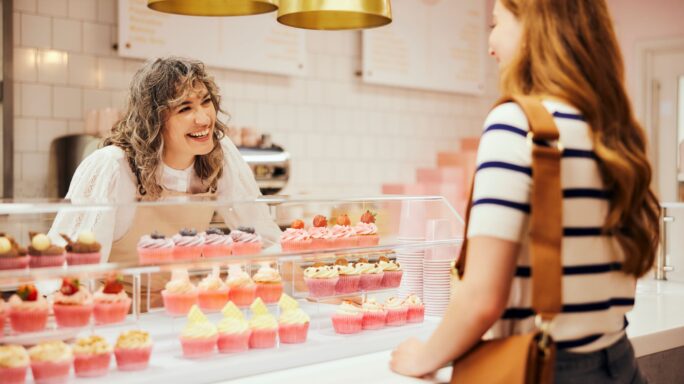 Woman working in cupcake bakery