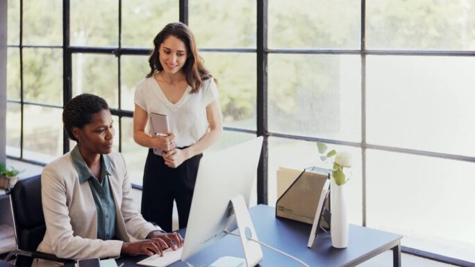 Two women working together in an office