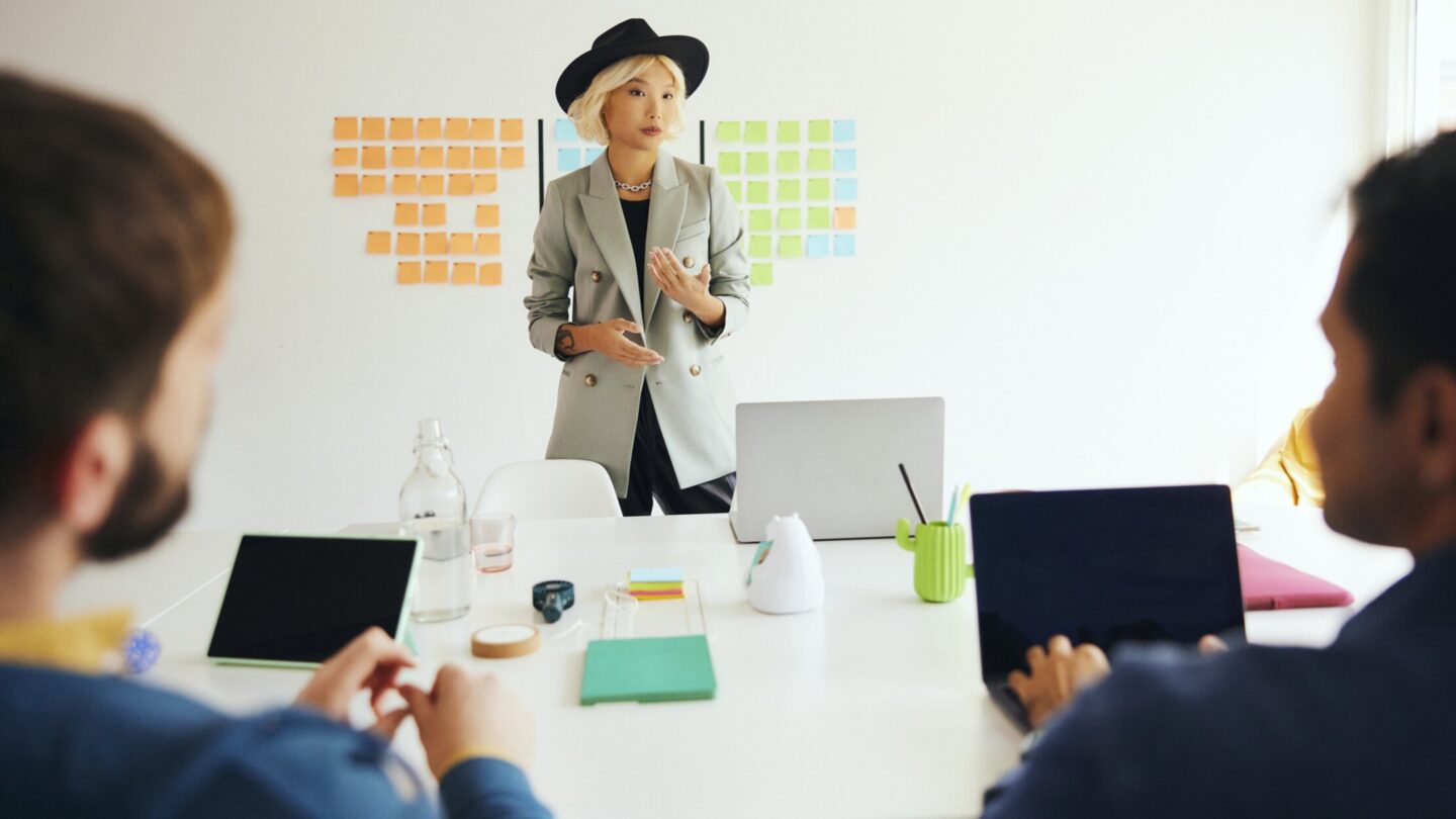 A person giving a presentation to colleagues.